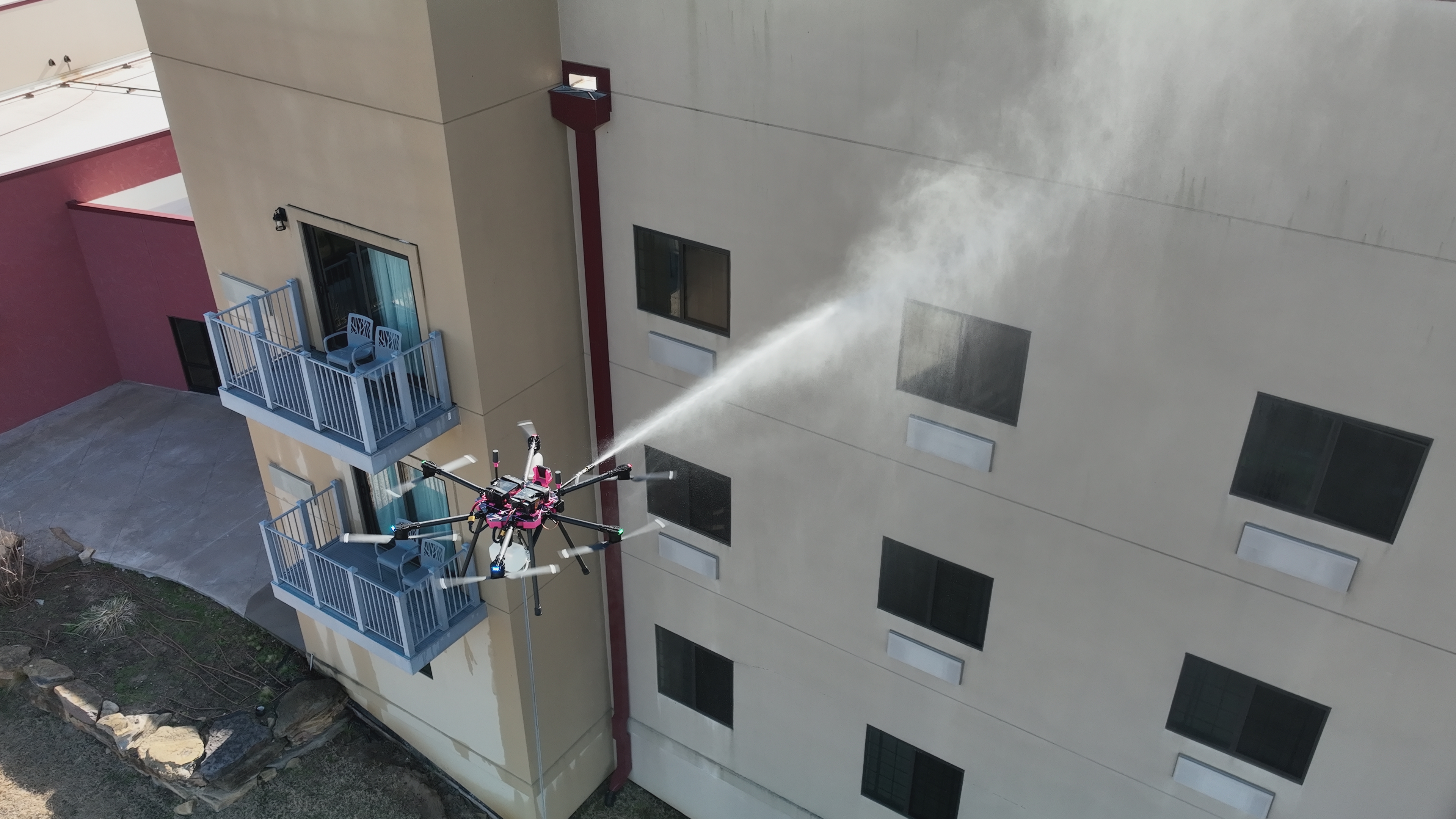 Drone soft washing exterior wall