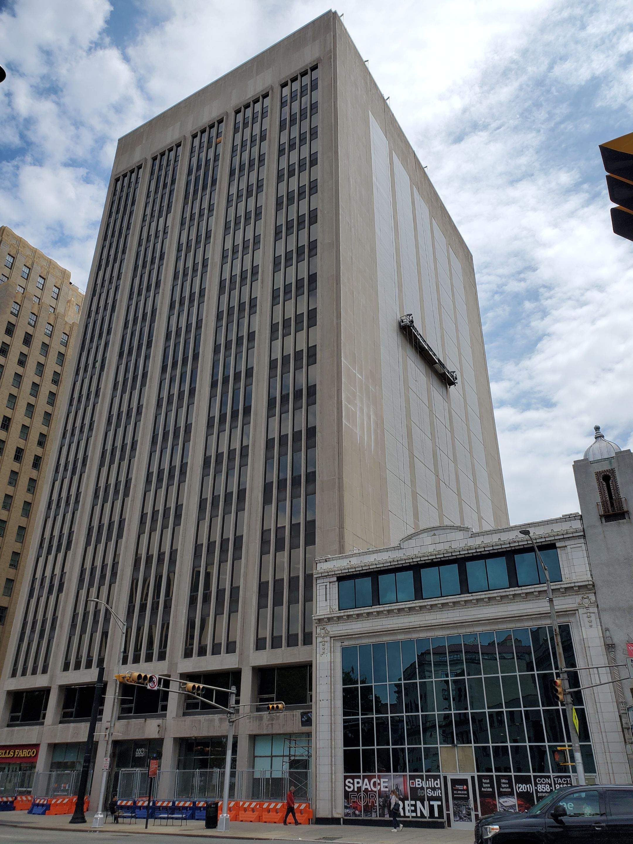 Tall commercial building prepared for exterior washing