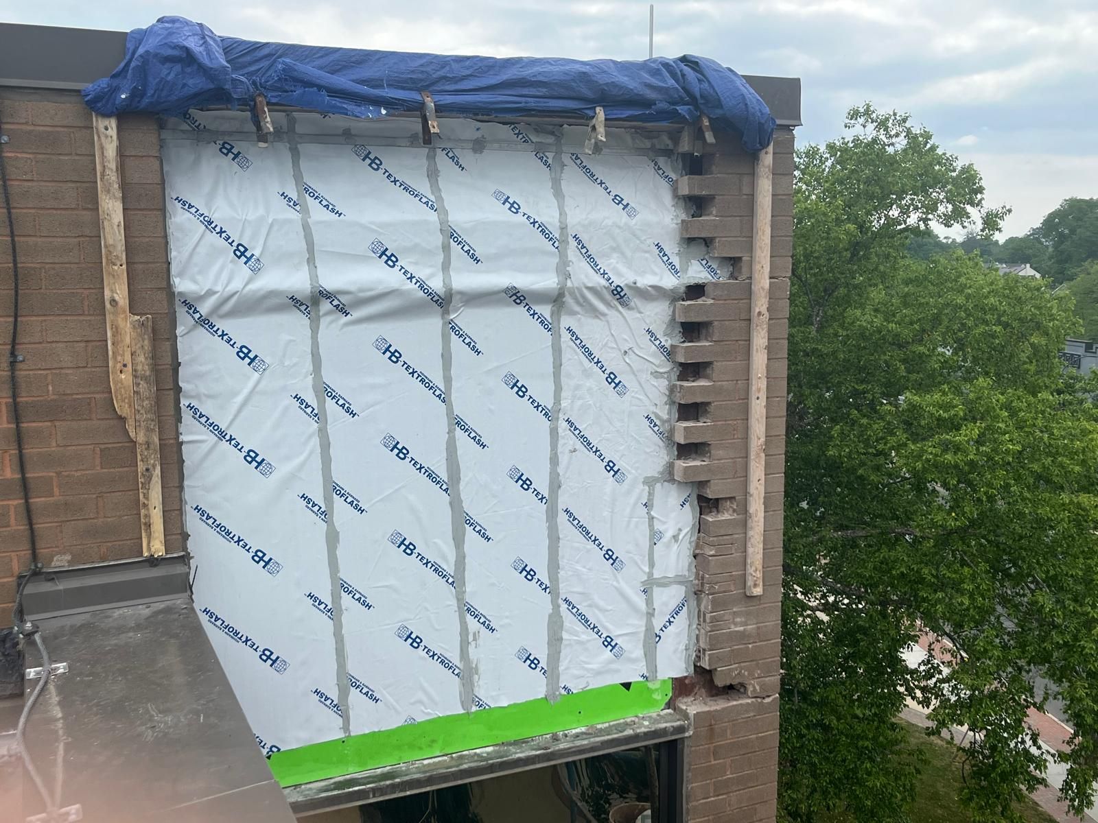 Weather barrier and masonry wall repair