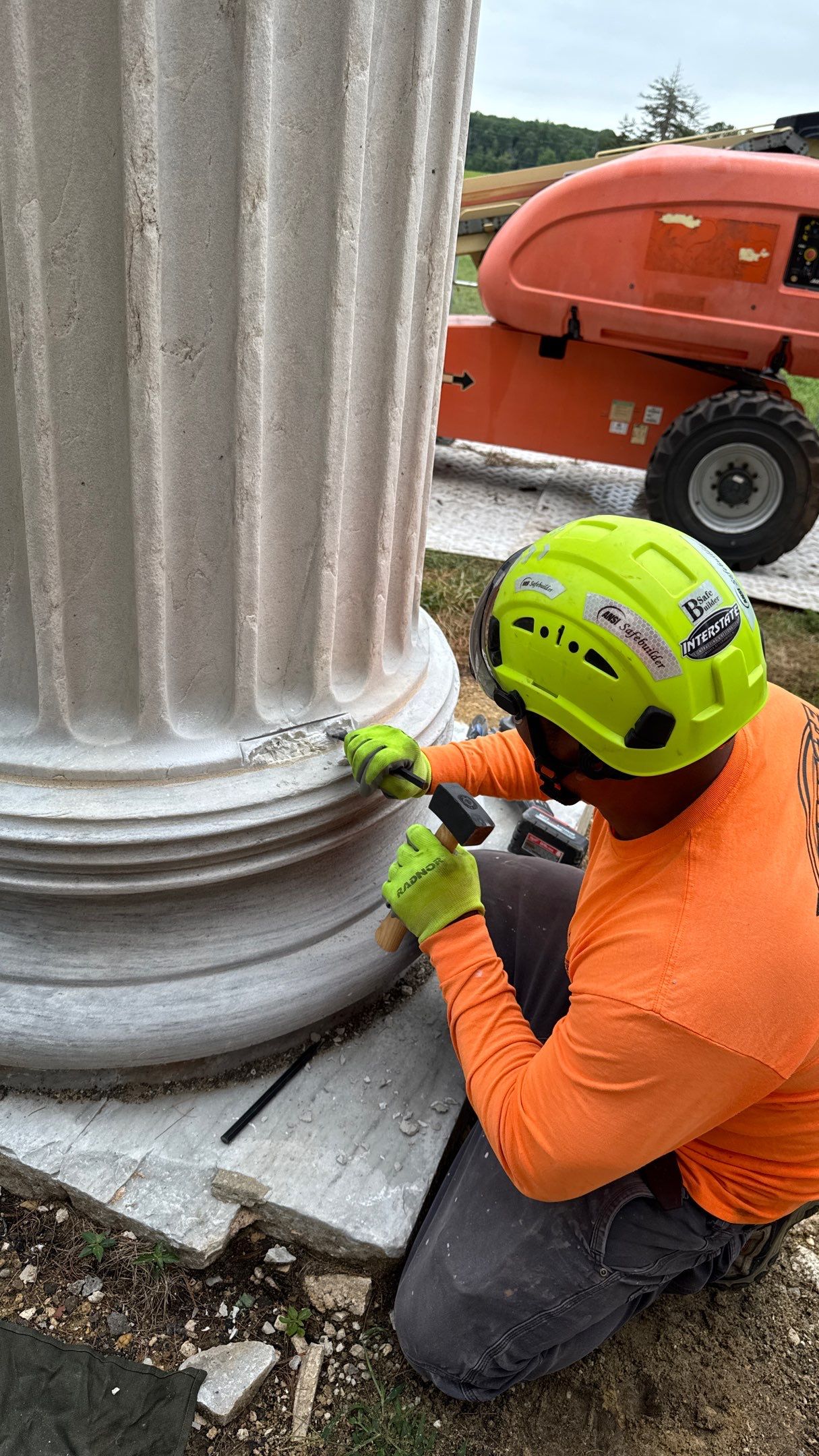 Technician restoring historic stone detail