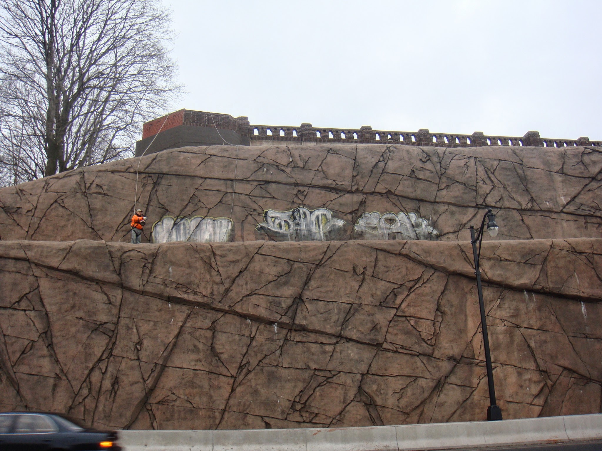Graffiti on masonry wall before removal