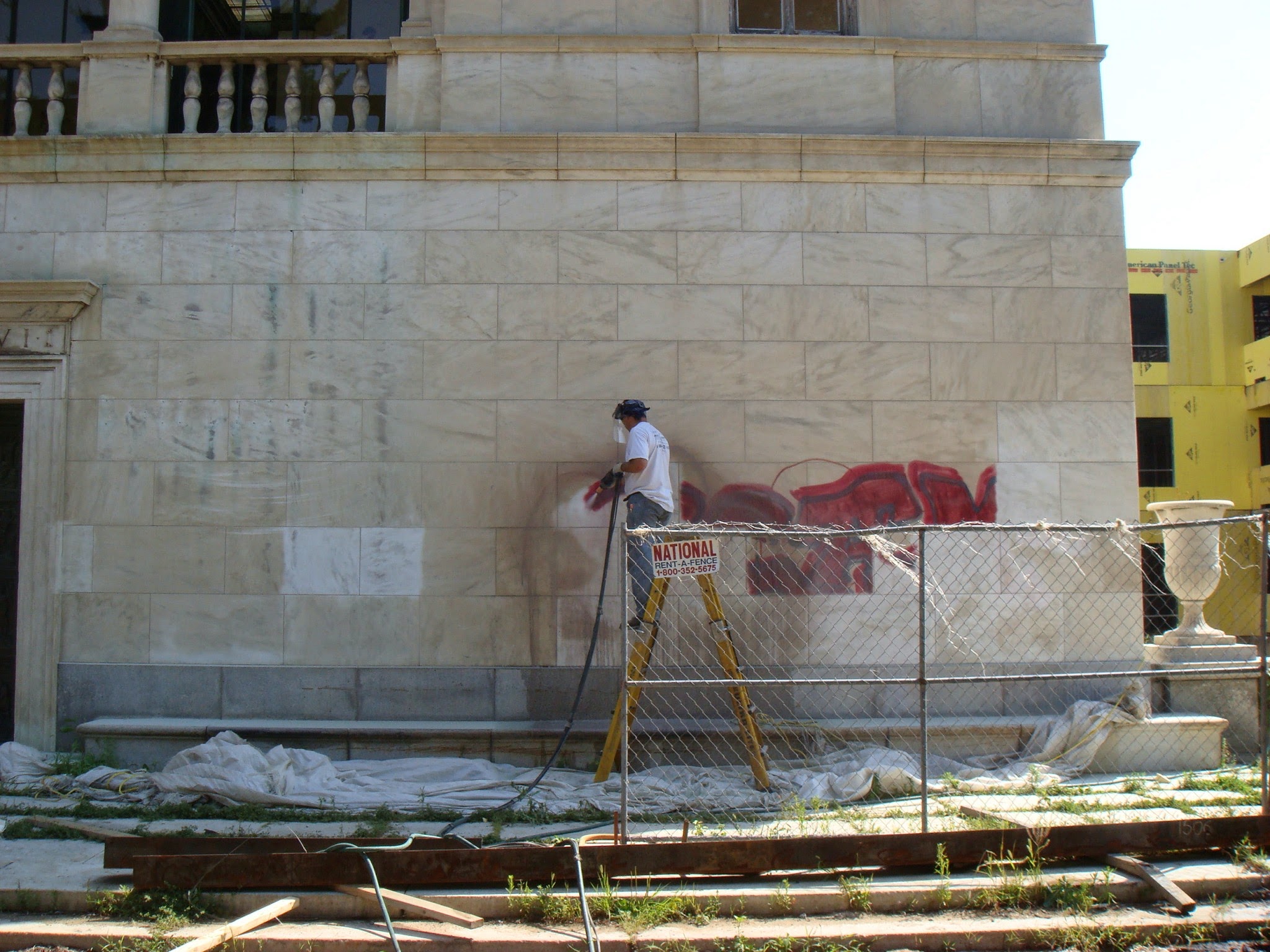 Coating removal on light stone facade
